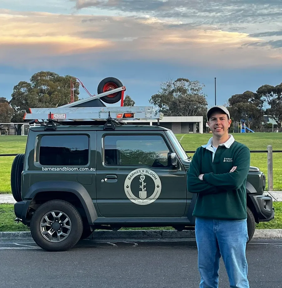 Ryan Barnes, founder of Barnes and Bloom, working in a plant-led garden in Melbourne